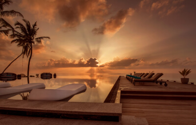 View of infinity pool at the sunset