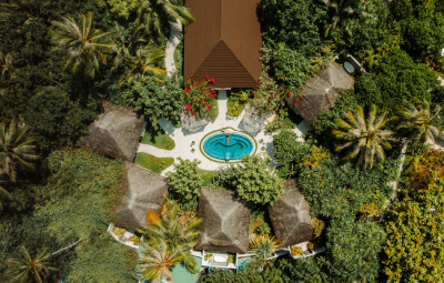 Aerial View of pool beach villa at Fushifaru Maldives Resort